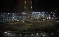 Muslims pray at the Grand Mosque in the holy city of Mecca ahead of the annual Haj pilgrimage October 7, 2013. Picture was taken behind a glass window. REUTERS/Ibraheem Abu Mustafa (SAUDI ARABIA - Tags: RELIGION)