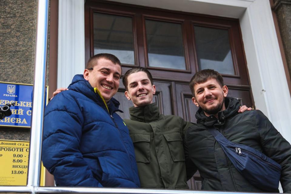 (L-R) Activists Roman Sinitsyn, Roman Ratushnyi, and Pavlo Petrychenko in front of the Pechersk District Court, where the pre-trial restraint was imposed on the participants of the rally in support of another activist, Serhiy Sternenko, in Kyiv, Ukraine, on March 23, 2021. (Herman Krieger / Watchers.Media)