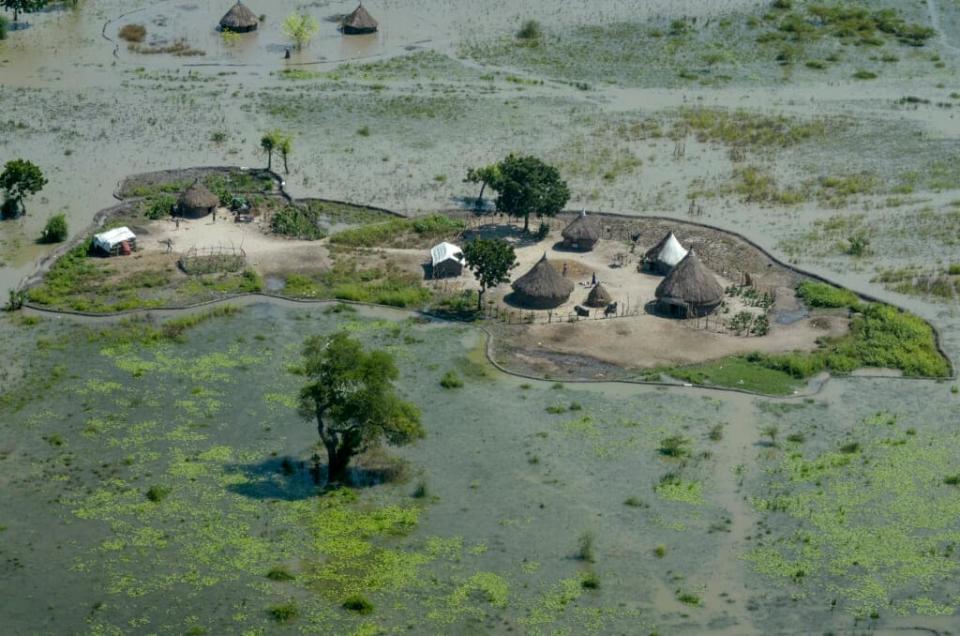 Thatched huts surrounded by floodwaters in November 2020 are seen from the air in Old Fangak county, Jonglei state, South Sudan. (AP Photo/Maura Ajak, File)