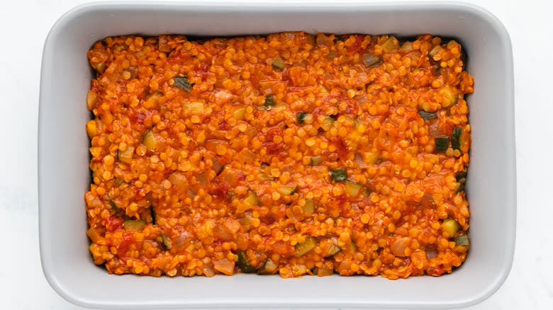 Tomato lentil sauce in baking dish