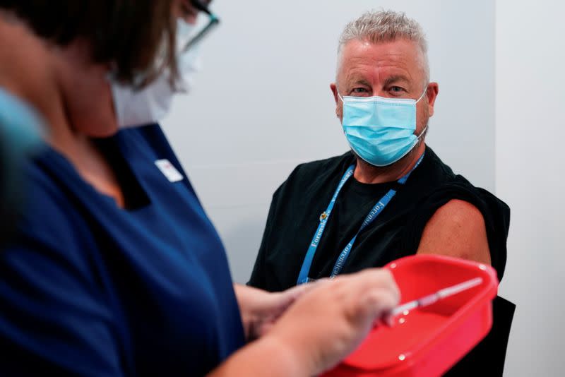 FILE PHOTO: The Pfizer COVID-19 vaccine is prepared for a high-risk worker in Melbourne