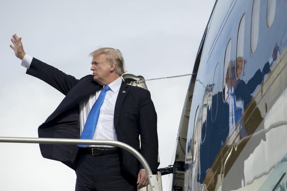 President Donald Trump boards Air Force One at Ninoy-Aquino International Airport in Manila, Philippines, Tuesday, Nov. 14, 2017, to travel to Hickam Air Force Base, Hawaii and then on to Washington. Trump is wrapping up a five country trip through Asia traveling to Japan, South Korea, China, Vietnam and the Philippines. (AP Photo/Andrew Harnik)