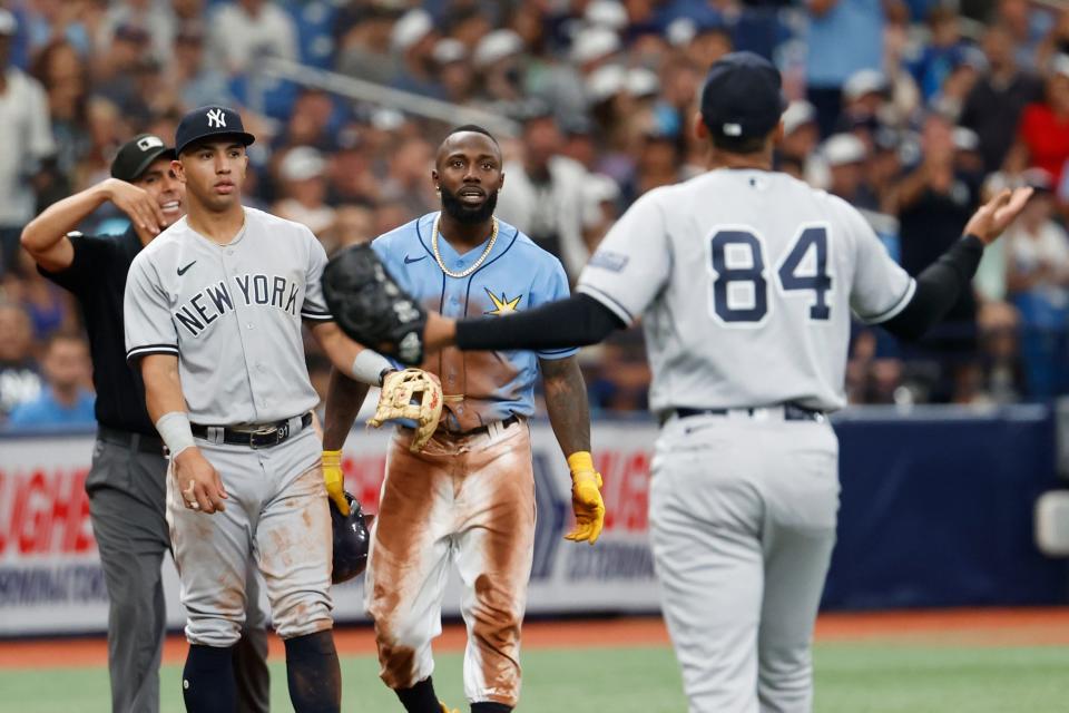 Tampa Bay Rays' Randy Arozarena argues with New York Yankees relief pitcher Albert Abreu (84) during the eighth inning.
