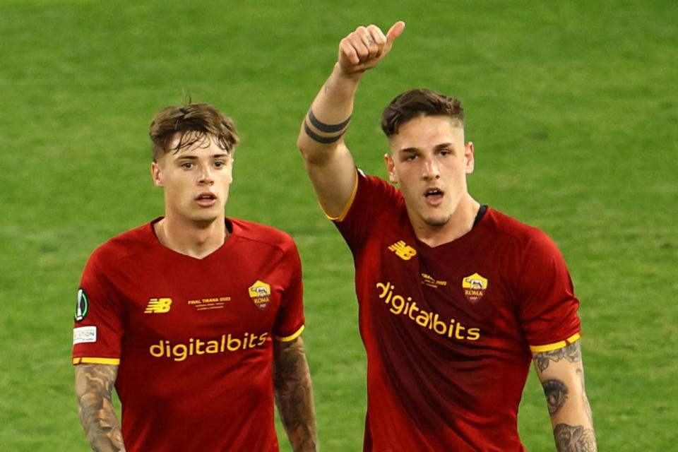 Nicolo Zaniolo celebrates a goal with Nicola Zalewski (left). (REUTERS)