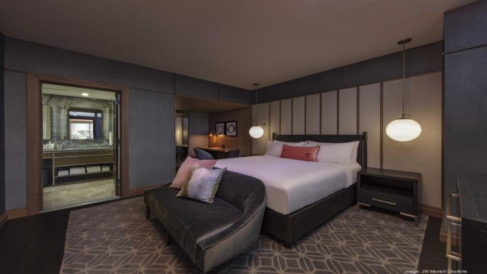 The master bedroom includes an ensuite bathrooms with an oversized shower. - Credit: JW Marriott