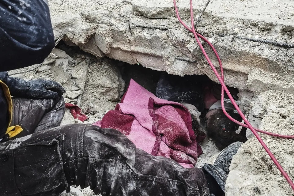 Syrian civil defense members search for people under the rubble of a destroyed building in Afrin, Syria, Monday, Feb. 6, 2023. (Zana Halil/DIA images via AP)