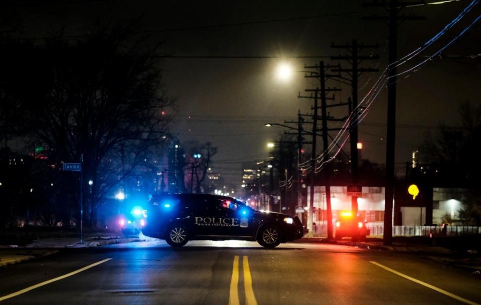 Law enforcement are seen surrounding the building in Detroit where the Crumbleys were found (Getty)