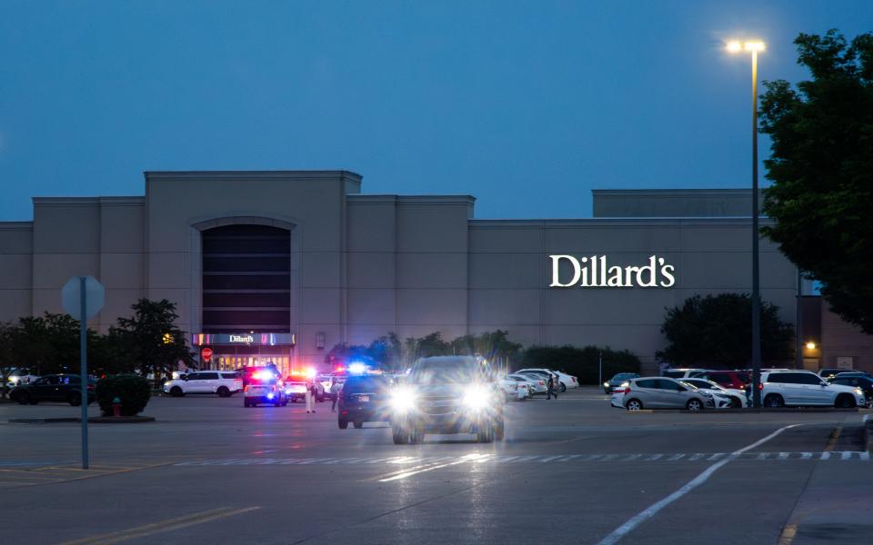 Evansville Police Department squad cars - along with civilian vehicles - parked outside Eastland Mall Sunday, May 14, 2023, after a large fight reportedly broke out and resulted in a heavy response from law enforcement.