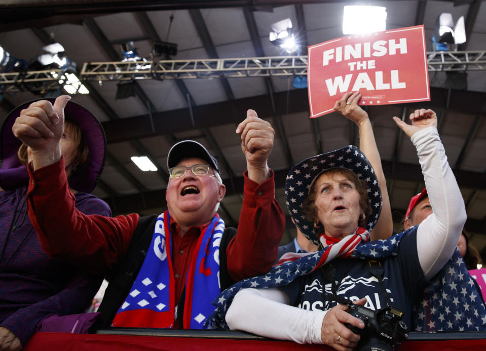 People in the audience cheer as President Donald Trump speaks at a campaign rally at Minuteman Aviation Hangar, Thursday, Oct. 18, 2018, in Missoula, Mont. (AP Photo/Carolyn Kaster)