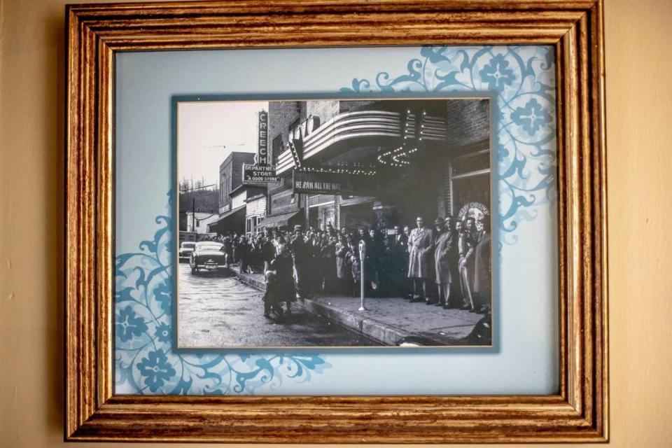 A photo in the lobby of the historic Novo Theater building shows a crowd lined up outside the business in downtown Cumberland, Ky., on its opening day.