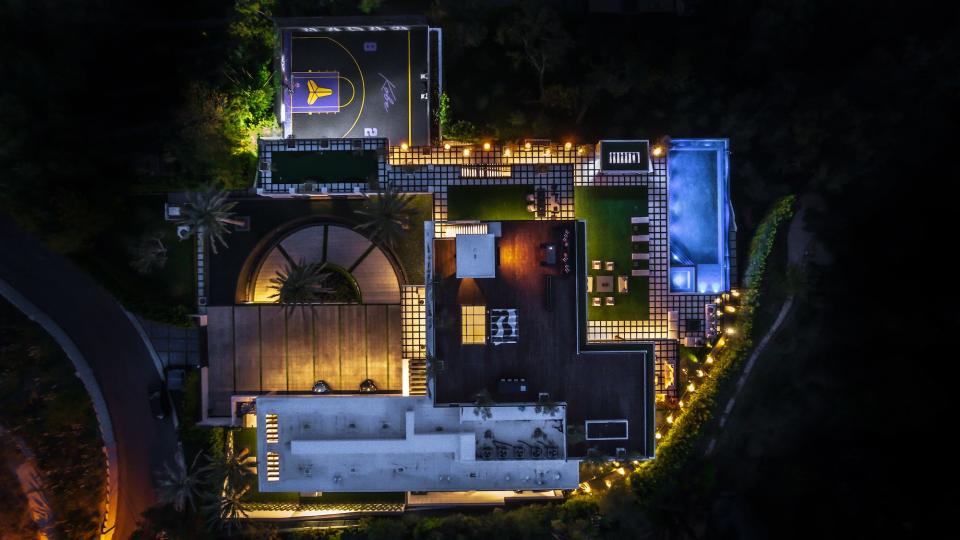 An overhead view of Star Resort in Los Angeles showcases the rooftop lounge area, as well as an infinity pool and a half basketball court.