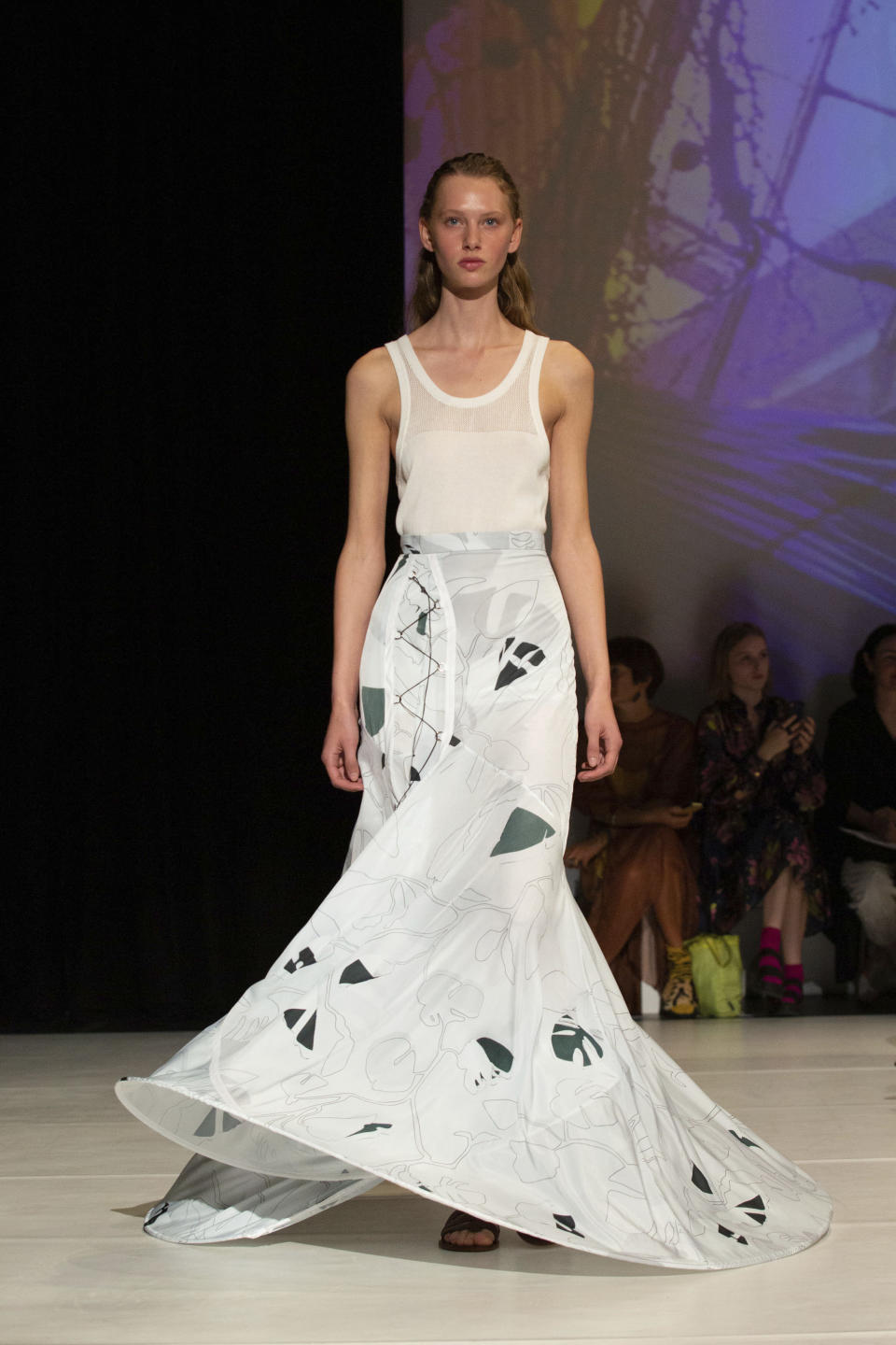 A model on the catwalk during the Chalayan Spring/Summer 2020 London Fashion Week show at Sadler's Wells Theatre in London, Sunday Sept. 15, 2019. (Katie Collins/PA via AP)