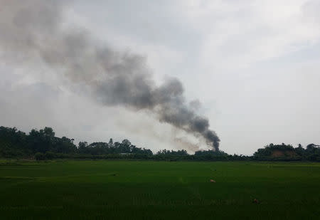 Smoke is seen on the Myanmar side of the border from Cox's Bazar, Bangladesh, September 4, 2017. REUTERS/Simon Lewis