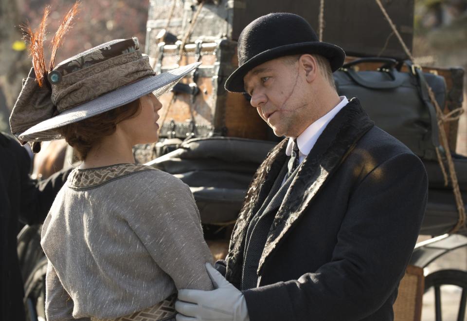 This image released by Warner Bros. shows Jessica Brown Findlay, left, and Russell Crowe in a scene from "Winter's Tale." (AP Photo/Warner Bros., David C. Lee)