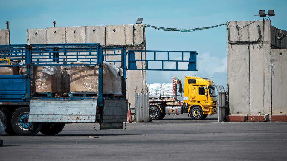 Trucks carrying aid move through security inspections at the Kerem Shalom crossing in March. - Marcus Yam/Los Angeles Times/Getty Images