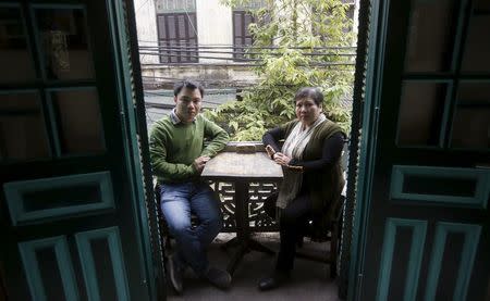 Nominees for Vietnam's National Assembly Nguyen Dinh Ha (L) and Dang Bich Phuong are seen after an interview at a cafe in Hanoi, Vietnam, February 18, 2016. Photo taken on February 18, 2016. REUTERS/Kham