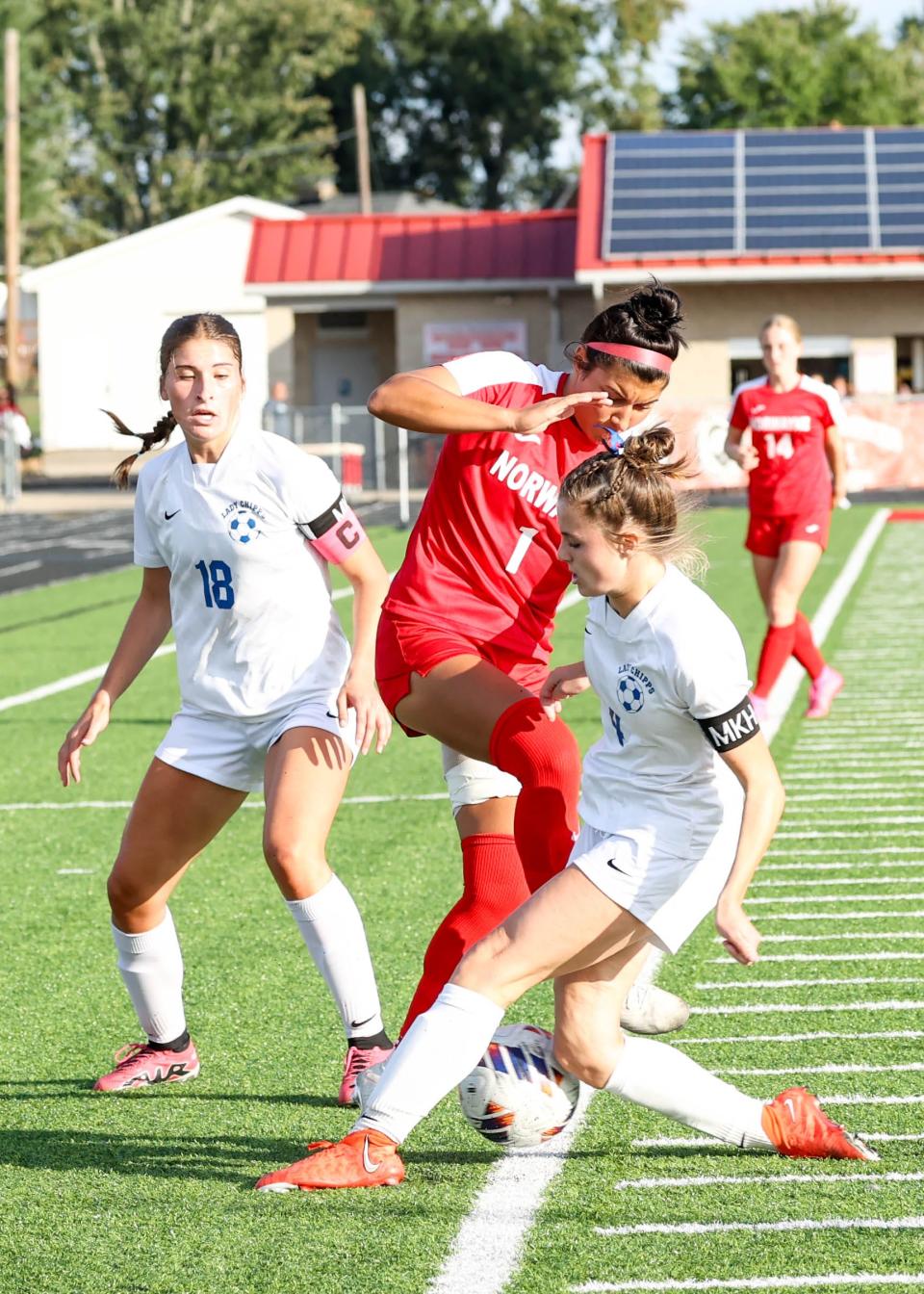 Norwayne's Shelby Vaughn battles Chippewa's Elena Moyer (18) and Addison Good (4) for this loose ball.