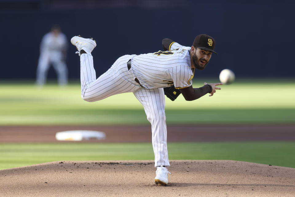 San Diego Padres starting pitcher Dylan Cease watches a throw to a Philadelphia Phillies batter during the first inning of a baseball game Saturday, April 27, 2024, in San Diego. (AP Photo/Brandon Sloter)