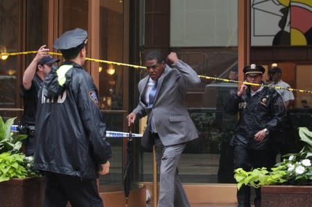 Man exits 787 7th Avenue in midtown Manhattan where helicopter crashed in New York