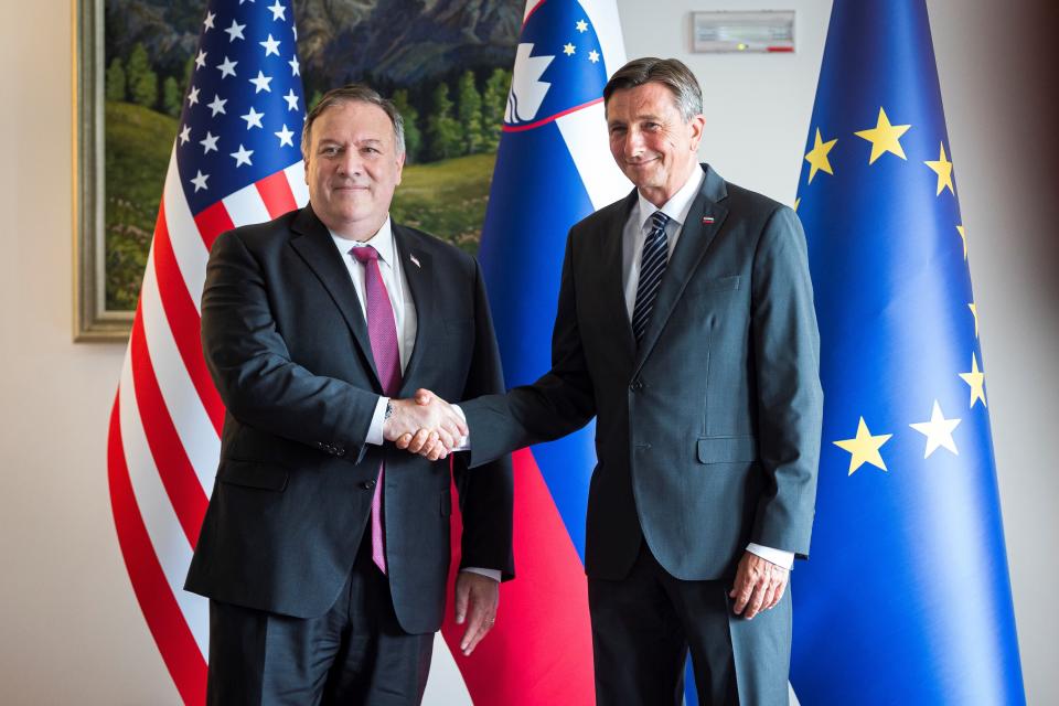 Slovenia's President Borut Pahor, right, and US Secretary of State Mike Pompeo pose for the media prior to their meeting in Bled, Slovenia, Thursday, Aug. 13, 2020. Pompeo is on a five-day visit to central Europe with a hefty agenda including China's role in 5G network construction. (Jure Makovec/Pool Photo via AP)