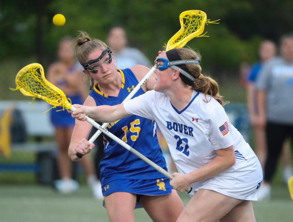 Caesar Rodney's Rylie Faircloth (15) and Dover's Ashtyn Torbert vie for a late draw.