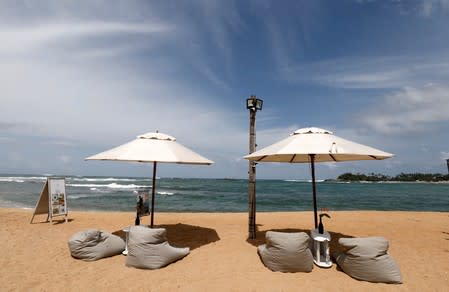 An empty beach seen in front of the Pearl Divers, a diving school, at Unawatuna beach in Galle