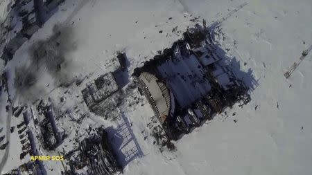 An aerial footage shot by a drone shows buildings of the Sergey Prokofiev International Airport damaged by shelling during fighting between pro-Russian separatists and Ukrainian government forces, in Donetsk, eastern Ukraine, seen in this still image taken January 15, 2015 from handout video by Army. REUTERS/Army.SOS/Handout via Reuters