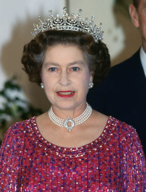 Queen Elizabeth II wearing the pearl and diamond choker to an engagement in Bangladesh in 1983 - Credit:  Tim Graham/Getty Images