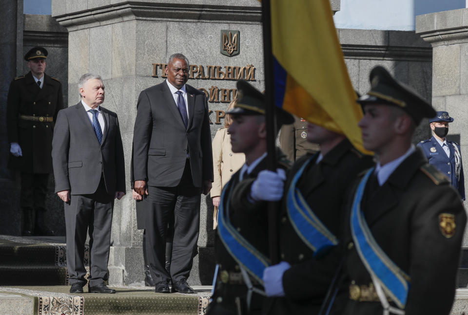 Ukrainian Defense Minister Andriy Taran, left, and U.S. Defense Secretary Lloyd Austin review the honor guard during a welcome ceremony ahead of their meeting in Kyiv, Ukraine, Tuesday, Oct. 19, 2021. (Gleb Garanich/Pool Photo via AP)