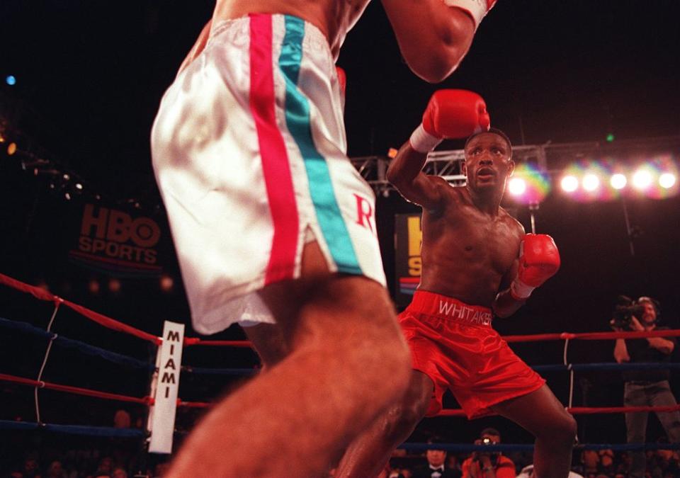 20 Sep 1996: Pernell Whitaker (right) measures his punch during his bout versus Wilfredo Rivera at James L. Knight Center in Miami, Florida. Whitaker won the bout in a 12 round decision. Mandatory Credit: Al Bello/ALLSPORT