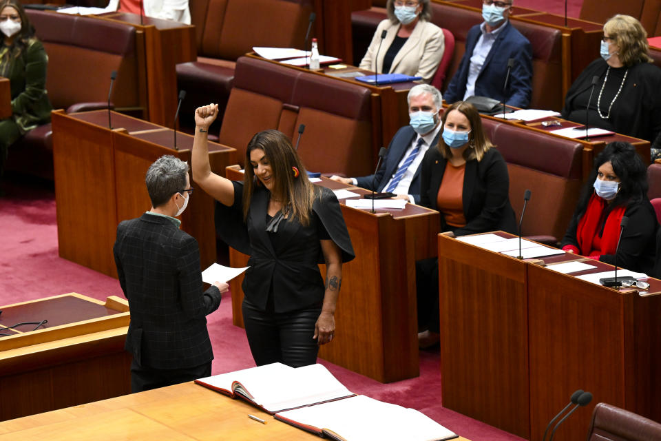 Australia Greens Senator for Victoria Lidia Thorpe raises her arm during her swearing-in ceremony in the Senate chamber on Monday. Source: AAP