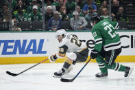 Vegas Golden Knights left wing William Carrier (28) controls the puck on an attack as Dallas Stars defenseman Esa Lindell (23) defends in the second period in Game 5 of an NHL hockey Stanley Cup first-round playoff series in Dallas, Wednesday, May 1, 2024. (AP Photo/Tony Gutierrez)