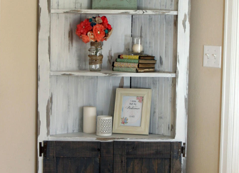 <body> <p>For less than $100 and a few hours of work, this rustic corner cabinet could be yours. The genius design might be your favorite piece of furniture for the way it adds style and function to a previously empty corner. The <a rel="nofollow noopener" href=" http://www.bobvila.com/articles/open-shelving-kitchen/?#.V7x91JMrIcg?bv=yahoo" target="_blank" data-ylk="slk:open shelving;elm:context_link;itc:0;sec:content-canvas" class="link ">open shelving</a> on top and closed cabinet on the bottom work together to give a home to all the things you want to display and everything you don't.</p> <p><strong>Related: <a rel="nofollow noopener" href=" http://www.bobvila.com/slideshow/18-sneaky-ways-to-diy-top-dollar-decor-50120?#.V796RJMrKRs?bv=yahoo" target="_blank" data-ylk="slk:18 Sneaky Ways to DIY Top-Dollar Decor;elm:context_link;itc:0;sec:content-canvas" class="link ">18 Sneaky Ways to DIY Top-Dollar Decor</a> </strong> </p> </body>