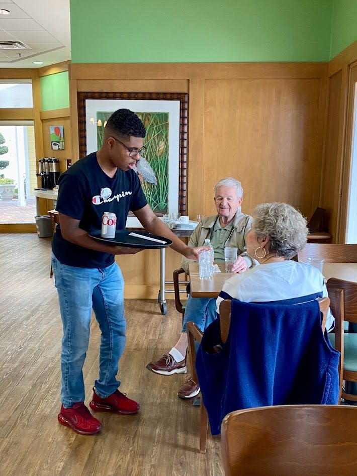 Intern Caleb Clayton works in dining services at a St. Johns County retirement community as part of Project SEARCH, which provides career training for young adults with developmental differences.