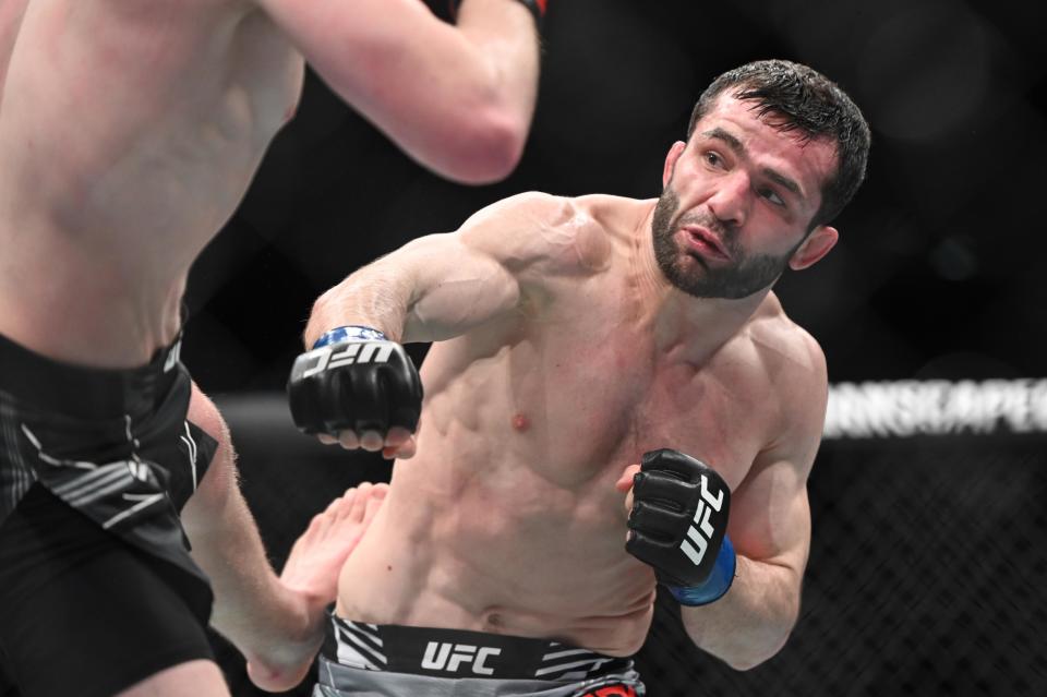 Mar 19, 2022; London, UK; Jack Shore (red gloves) defeats Timur Valiev (blue gloves) during UFC Fight Night at O2 Arena. Mandatory Credit: Per Haljestam-USA TODAY Sports