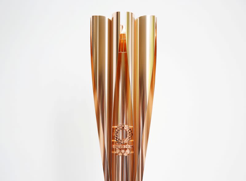 FILE PHOTO: The Olympic torch of the Tokyo 2020 Olympic Games is displayed at a Torch Relay event to mark the 300-day milestone to the starting date of the torch relay, in Tokyo