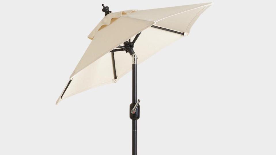 This tilting patio umbrella will keep you cool and protect you from the sun's harmful rays.