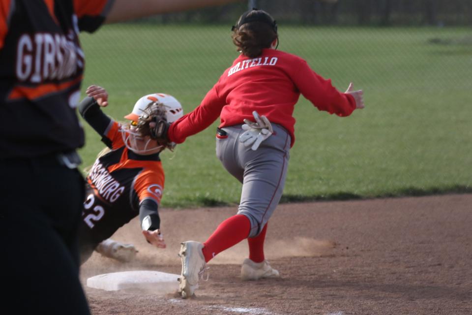 SJCC's Maddie Militello tags Gibsonburg's Mariah McNett before she reaches third base.