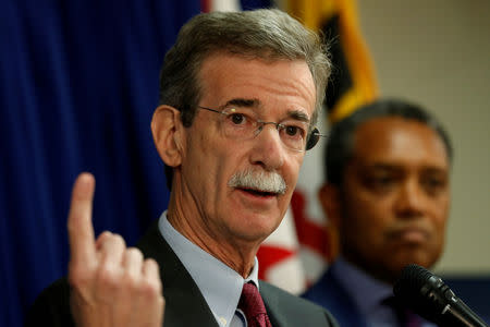 FILE PHOTO: Maryland Attorney General Brian Frosh (L) and District of Columbia Attorney General Karl Racine (R) hold a news conference to announce their lawsuit against U.S. President Donald Trump on the issue of the U.S. Constitution's emoluments clauses and Trump's business ventures, in Washington, DC, U.S. June 12, 2017. REUTERS/Jonathan Ernst/File Photo
