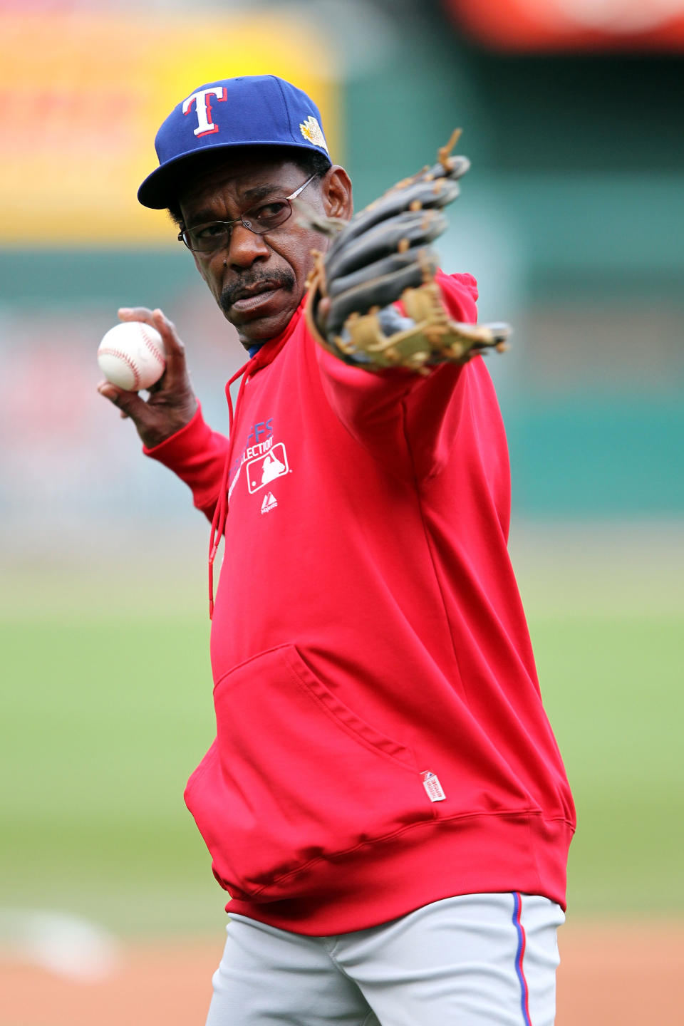 ST LOUIS, MO - OCTOBER 20: Manager Ron Washington of the Texas Rangers throws a ball on the field during practice prior to Game Two of the MLB World Series against the St. Louis Cardinals at Busch Stadium on October 20, 2011 in St Louis, Missouri. (Photo by Jamie Squire/Getty Images)