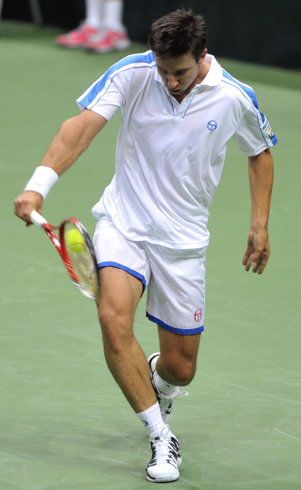 Igor Sijsling from the Netherlands returns the ball to Tomas Berdych from the Czech Republic during their Davis Cup first round singles match in Ostrava, Czech Republic, Friday, Jan. 31, 2014. (AP Photo,CTK/Jaroslav Ozana) SLOVAKIA OUT