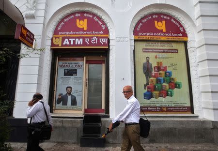 People walk past Punjab National Bank's Brady House branch in Mumbai, India June 14, 2018. REUTERS/Francis Mascarenhas