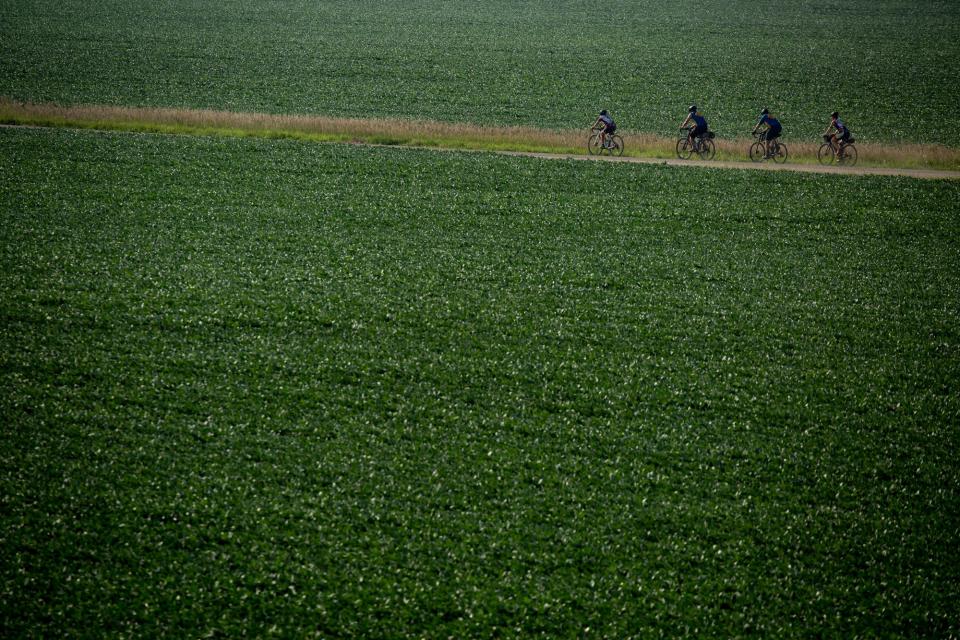 Cyclists ride the first optional full gravel day of RAGBRAI in 2021. The route took riders over 70 miles with nearly 1,400 feet of climb.