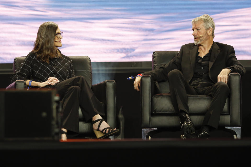 MIAMI, FLORIDA - APRIL 7: Michael Saylor (R), Chairman &amp; CEO, MicroStrategy, gestures as he speaks during the Bitcoin 2022 Conference, next to Catherine Wood, chief executive officer and chief investment officer, Ark Invest, at Miami Beach Convention Center on April 7, 2022 in Miami, Florida. The world's largest bitcoin conference runs from April 6-9, expecting over 30,000 people in attendance and over 7 million live stream viewers worldwide. (Photo by Marco Bello/Getty Images)