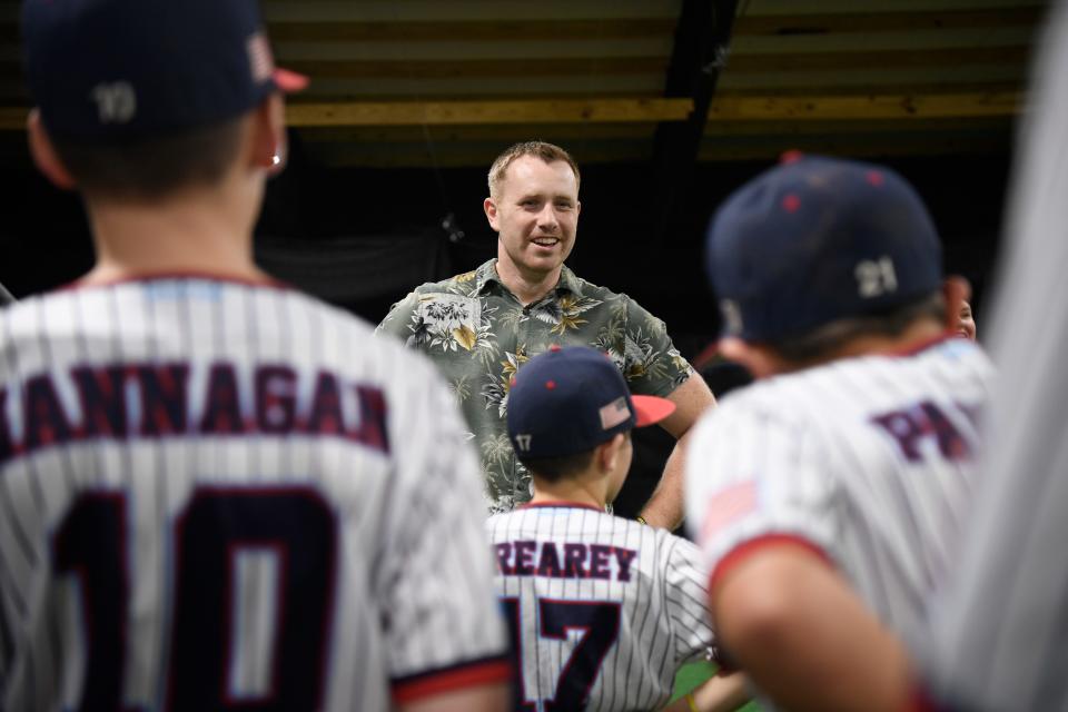 Carl Bott, founder of Legacy Photo Company, speaks to young athletes before bringing his portrait sessions at Mustangs Baseball Association Field House in Mt. Juliet, Tenn., Wednesday, Dec. 13, 2023.