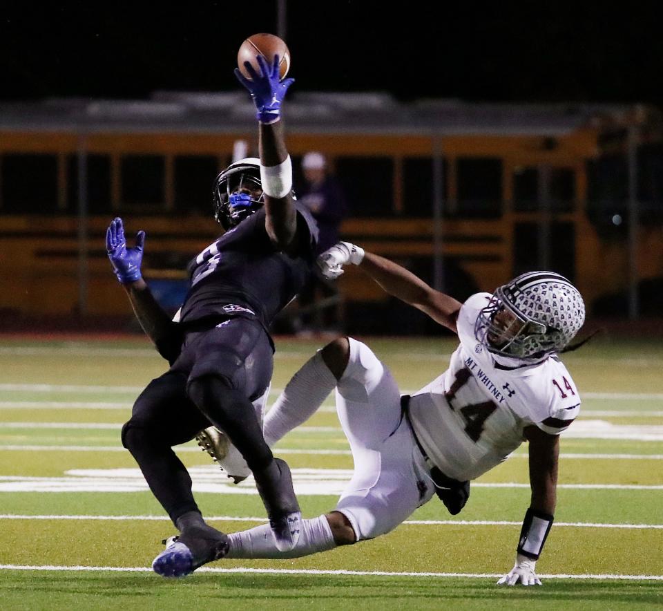 Mission Oak's Kenny Jackson picks off a pass for an interception with one hand against Mt. Whitney during their Central Section Division III high school quarterfinal football game in Tulare, Calif, Thursday, Nov. 9, 2023.