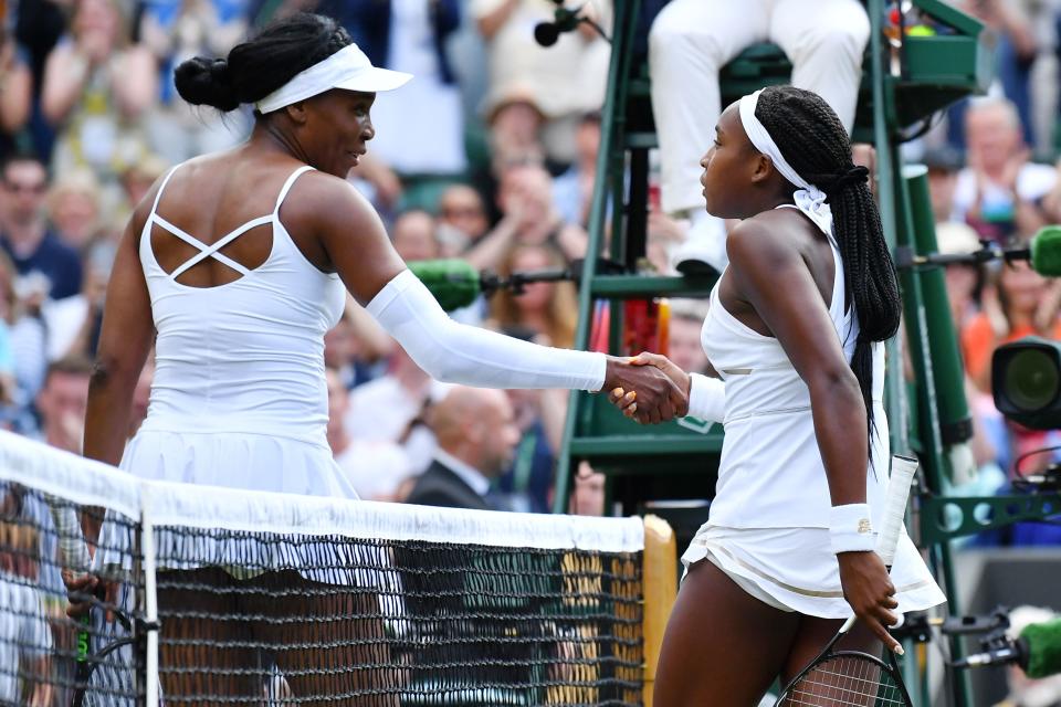 US player Cori Gauff is congratulated by US player Venus Williams after winning their women's singles first round match on the first day of the 2019 Wimbledon Championships at The All England Lawn Tennis Club in Wimbledon, southwest London, on July 1, 2019. (Photo by Ben STANSALL / AFP) / RESTRICTED TO EDITORIAL USE        (Photo credit should read BEN STANSALL/AFP via Getty Images)