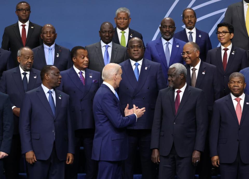 U.S. President Joe Biden talks to fellow leaders during the group photo at the U.S.-Africa Leaders Summit on Dec.15, 2022, in Washington, D.C. (Photo by Kevin Dietsch/Getty Images)