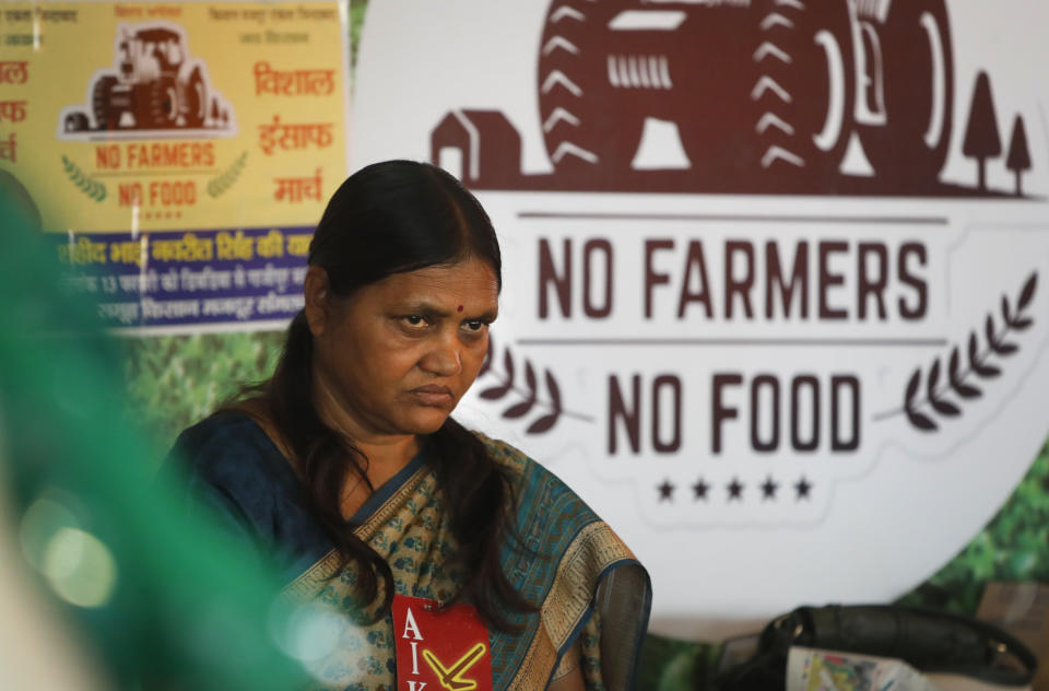 An Indian female farmer activist participates in a protest at the site of ongoing protests by farmers in Ghazipur, Delhi-Uttar Pradesh border, near New Delhi, India, Monday, March 8, 2021. Thousands of female farmers have held sit-ins and a hunger strike in India's capital in protests on International Women's Day against new agricultural laws. (AP Photo/Manish Swarup)