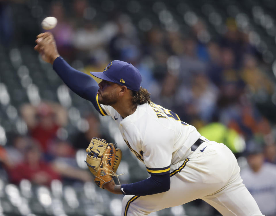 Milwaukee Brewers starting pitcher Freddy Peralta throws to a Miami Marlins batter during the first inning of a baseball game Tuesday, Sept. 12, 2023, in Milwaukee. (AP Photo/Jeffrey Phelps)